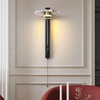 Black marble wall sconce dimmable installed in hotel lobby
