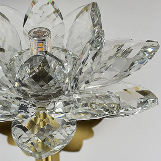 Gold lotus wall sconce installed in luxury hotel lobby