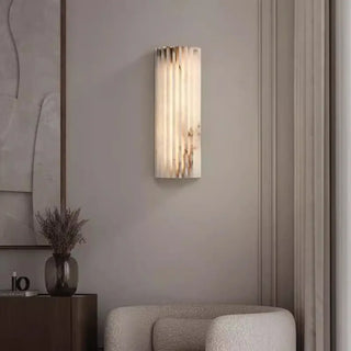 Beige marble wall sconce dimmable installed in boutique hotel
