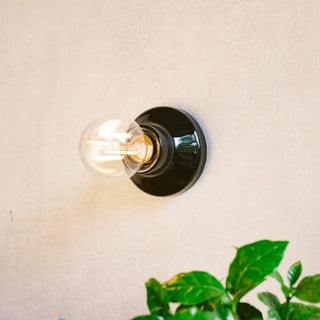 Scandinavian disc wall light white 10cm – angle view