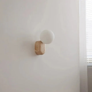 Wood wall sconce with opal glass globe close-up – dimmable 3000K