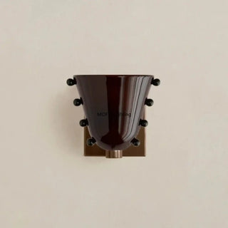 Brown glass wall sconce E27 colored diffuser close-up