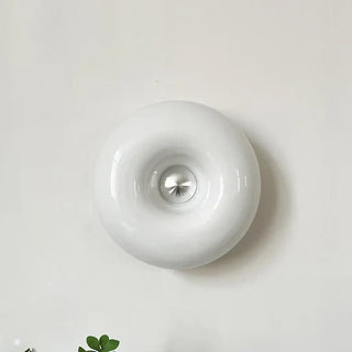 White glass donut sconce installed – Scandinavian 3000K warm ring glow