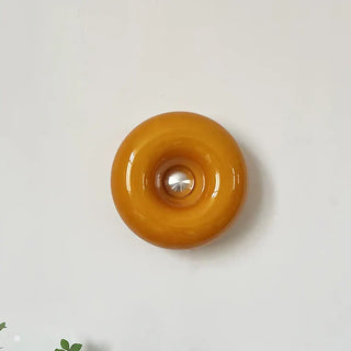 Orange glass ring wall light close-up – dimmable donut shape detail