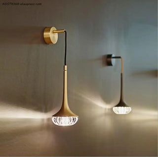 LUMINI wall sconce close-up brass and glass texture detail