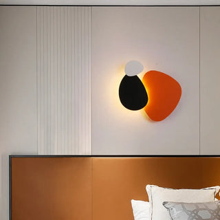 Bold orange LED wall sconce dimmable installed – close-up