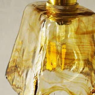 Amber glass wall sconce gold detail modern 3000K close-up