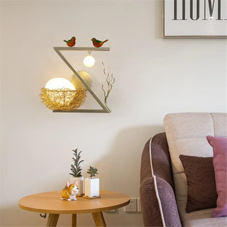 Golden nest art wall sconce detail close-up – birds and ball accent