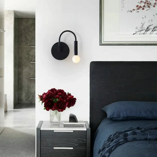 Modern black wall sconce minimalist hotel design detail