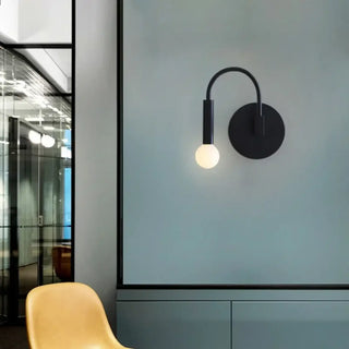 Minimalist black wall sconce hotel room modern design