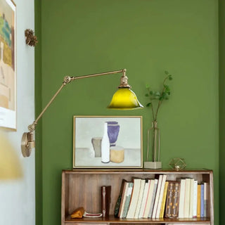 Green acrylic brass wall light close-up – adjustable arm vintage