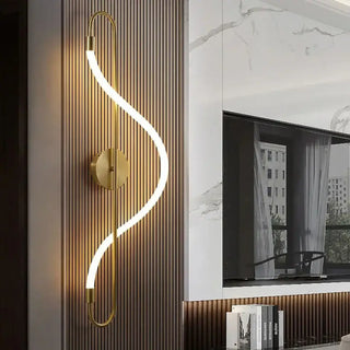 Black long tube wall sconce installed in modern entryway