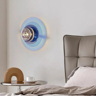 Spira colored disc sconce installed – layered light effect