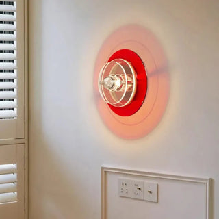 Spira tri-color disc LED wall sconce – front view