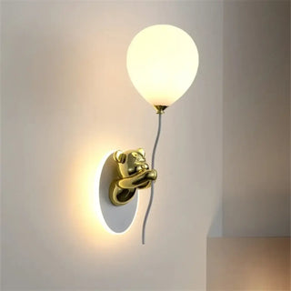 Gold bear wall sconce installed in children's bedroom