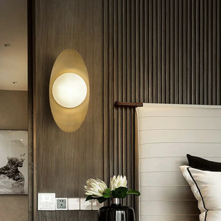 Oval gold wall sconce G9 with white glass ball – front view