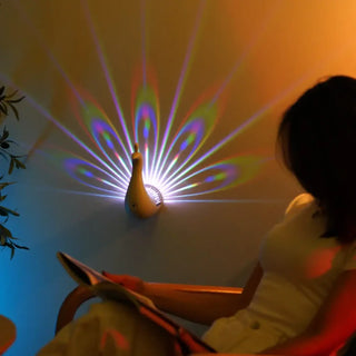 Peacock LED wall sconce G4 pink light projection – front view