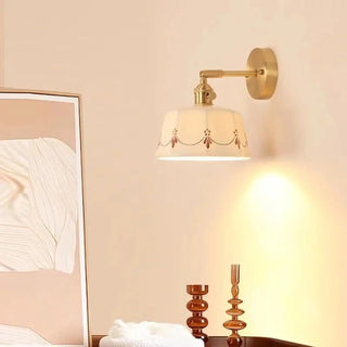 TANGERE brass wall light with ceramic pattern
