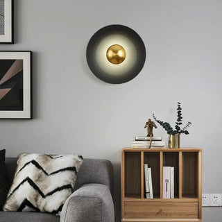 Black round G9 wall sconce installed in contemporary room