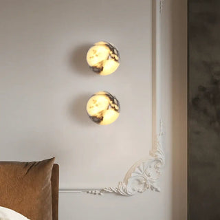 Black marble wall sconce close-up – G9 LED circular natural stone texture