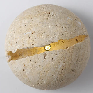 Beige split stone wall sconce close-up texture detail