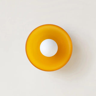 Round glass wall sconce installed view modern