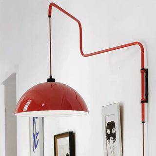 Red curved arm sconce close-up metal acrylic