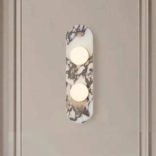 White 3-light marble wall sconce IP65 installed in boutique
