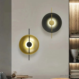 Target wall sconce brass black sculptural close-up