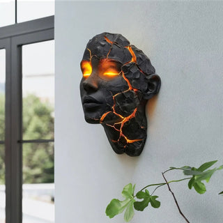 sculptural black resin wall light – Art Deco cracked face