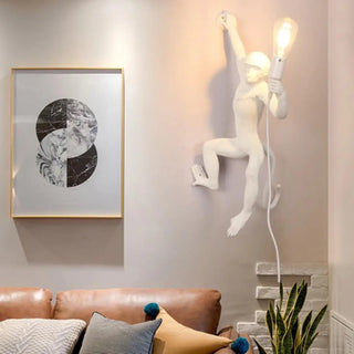 Monkey LED sconce installed living room – warm glow