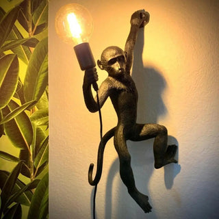Monkey wall sconce bedroom setting artistic