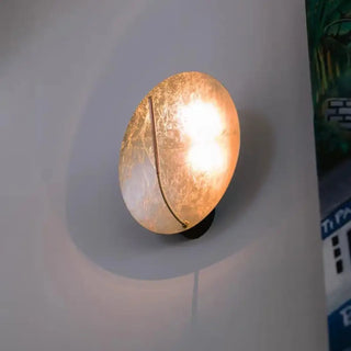 Gold full moon wall sconce IP65 installed in grand interior