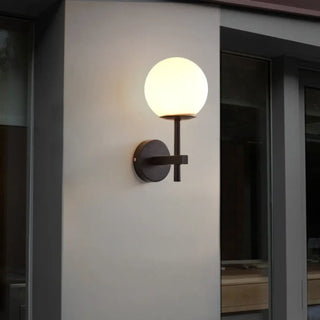 Elegant gold and glass wall sconce installed – tinted shade 30cm bedroom