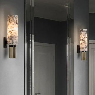 Marble wall sconce close-up natural marble and gold base
