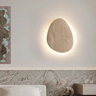 Natural stone wall sconce front view – travertine beige 3000K interior