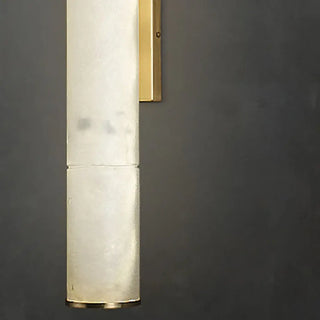 White marble tubular wall sconce installed in luxury interior