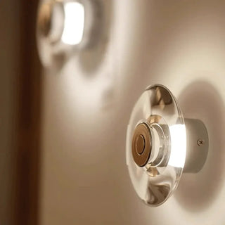 Silver LED wall sconce installed – halo glass glow S and M sizes