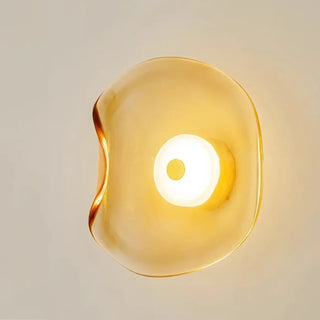 Amber organic glass sconce – warm glow detail
