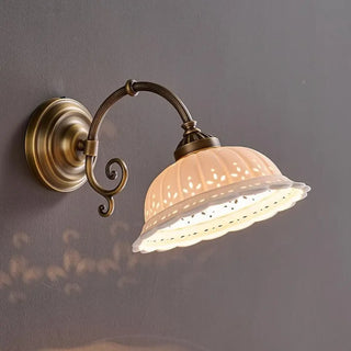 Vintage glass globe wall sconce cream – bronze metal close-up