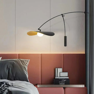 Large format black wall sconce G4 installed room view
