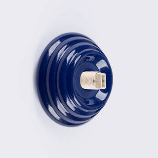Enamel designer modern wall sconce detail — bright uniform
