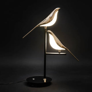 Elegant gold accent table lamp illuminated — soft ambient glow