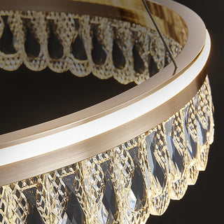 Crystal ring large chandelier detail — luxury modern dining warm