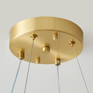 Modern pearl acrylic chandelier detail — LED ball brass warm texture