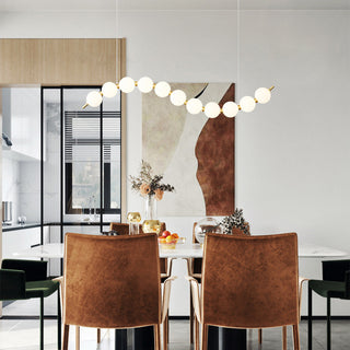 White ball pendant lights with brass acrylic chandelier