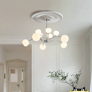 Modern sputnik chandelier detail — white globe iron warm texture