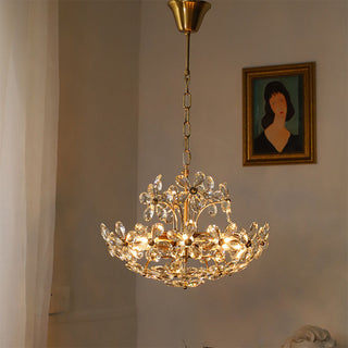 Modern brass crystal chandelier side — bouquet luxury dining warm