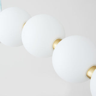 Modern white ball chandelier illuminated — brass acrylic pendant warm