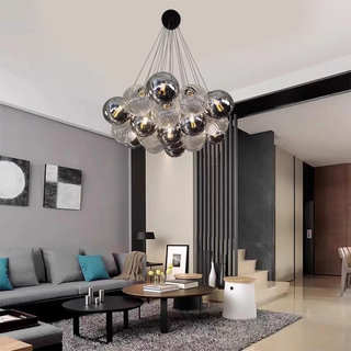 Modern bubble LED chandelier illuminated — glass ball dining warm